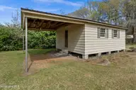 129 Pineland Avenue, Mount Olive, NC 28365 — 3-bedroom home in College Heights, Mount Olive, NC, photo 22 of 27: Barn with Shelter
