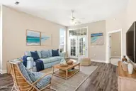 613 Elfin Court, Leland, NC 28479 — 2-bedroom townhome in Westport, Leland, NC, photo 6 of 28: Living Room Virtually Staged