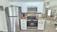 108 Willowbend Drive, Burgaw, NC 28425 — 3-bedroom home in Tealbriar, Burgaw, NC, photo 12 of 27: Tiled backsplash and granite