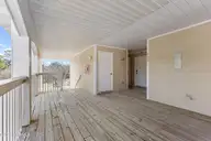 3350 Club Villas Drive # 405, Southport, NC 28461 — 2-bedroom condo in St James, Southport, NC, photo 5 of 39: front porch