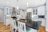 121 Sea Isle North Drive & Slip 20, Indian Beach, NC 28512 — 3-bedroom waterfront home in Sea Isle Plantation North, Indian Beach, NC, photo 5 of 53: Kitchen with island