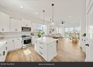 905 Basin Road Unit 4, Carolina Beach, NC 28428 — 3-bedroom townhome in Basin Park, Carolina Beach, NC, photo 5 of 68: 30-kitchen_living