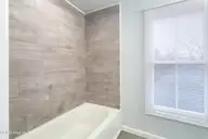 909 1st Street, Elizabeth City, NC 27909 — 3-bedroom home in Improvment Co of E.C., Elizabeth City, NC, photo 1 of 26: Primary Bathroom