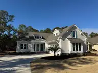 9418 Fallen Pear Lane NE, Leland, NC 28451 — 4-bedroom home in The Bluffs on the Cape Fear, Leland, NC, photo 1 of 16: LOT 206