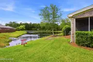 613 Elfin Court, Leland, NC 28479 — 2-bedroom townhome in Westport, Leland, NC, photo 24 of 28: backyard