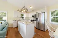 6611 Marsh Cove Road, Emerald Isle, NC 28594 — 3-bedroom waterfront home in Marsh Cove, Emerald Isle, NC, photo 12 of 52: Kitchen with granite countertops