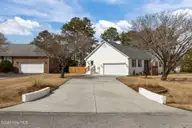100 Stevens Court, Swansboro, NC 28584 — 3-bedroom waterfront home in River Reach, Swansboro, NC, photo 9 of 56: Side Garage