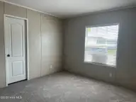 316 Commodore Drive, Rocky Mount, NC 27801 — 3-bedroom manufactured home in Eastfield, Rocky Mount, NC, photo 21 of 32: Bedroom #2 view 2