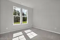 6825 Fellowship Drive, Leland, NC 28451 — 5-bedroom home in Grand Park, Leland, NC, photo 13 of 31: Downstairs Guest Suite