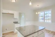 202 Broadleaf Drive, Jacksonville, NC 28546 — 4-bedroom waterfront home in Creekside at Aragona Village, Jacksonville, NC, photo 12 of 34: View of kitchen and dining area