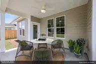 6707 Fellowship Drive, Leland, NC 28451 — 4-bedroom home in Grand Park, Leland, NC, photo 20 of 36: Covered porch