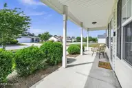7230 Copperfield Court, Wilmington, NC 28411 — 3-bedroom home in Holly Field, Wilmington, NC, photo 11 of 35: Front Porch