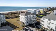 2905 Pointe West Drive 5b2, Emerald Isle, NC 28594 — 2-bedroom waterfront condo in Pier Pointe, Emerald Isle, NC, photo 1 of 28: 50-web-or-mls-DJI_20251215103901_0082_D