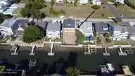 147 Swordfish Drive, Holden Beach, NC 28462 — 5-bedroom waterfront home, Holden Beach, NC, photo 8 of 12: canal drone view
