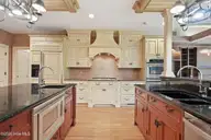 60 Lake Dornoch Drive, Pinehurst, NC 28374 — 4-bedroom waterfront home in CCNC, Pinehurst, NC, photo 16 of 70: Kitchen - Range & Sink Stations