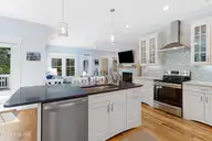 121 Sea Isle North Drive & Slip 20, Indian Beach, NC 28512 — 3-bedroom waterfront home in Sea Isle Plantation North, Indian Beach, NC, photo 6 of 53: Kitchen with island