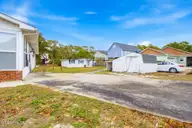 304 NE 50th Street, Oak Island, NC 28465 — 3-bedroom home, Oak Island, NC, photo 2 of 46: shniderproductions.com-2