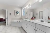 1310 Grandiflora Drive, Leland, NC 28451 — 4-bedroom home in Magnolia Greens, Leland, NC, photo 21 of 56: Primary bathroom