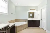 1454 Dunes Boulevard SW, Ocean Isle Beach, NC 28469 — 4-bedroom home in Retreat At OIB, Ocean Isle Beach, NC, photo 19 of 52: Spacious primary bath/toilet closet