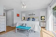 300 Mcginnis Drive, Pine Knoll Shores, NC 28512 — 3-bedroom waterfront condo in Mcginnis Point, Pine Knoll Shores, NC, photo 20 of 57: Primary First Floor Bedroom 1