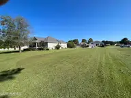 191 203 Ravennaside Drive NW, Calabash, NC 28467 — lot in Brunswick Plantation, Calabash, NC, photo 1 of 5