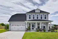 166 N Passerine Path, Hampstead, NC 28443 — 4-bedroom home in Songbird Landing, Hampstead, NC, photo 1 of 70: Front of Home