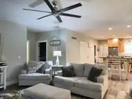 669 Pelican Circle, Bolivia, NC 28422 — 3-bedroom waterfront home in River Run Plantation, Bolivia, NC, photo 7 of 25: LR to kitchen