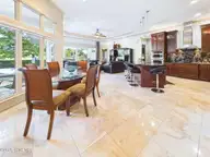 8900 Mahogany Run, Wilmington, NC 28411 — 3-bedroom home in Porters Neck Plantation, Wilmington, NC, photo 12 of 75: 21-web-or-mls-22_STILL068_dining-to-kitc