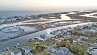 103 E Island Drive, Oak Island, NC 28465 — 3-bedroom waterfront home, Oak Island, NC, photo 4 of 76: 123_drone
