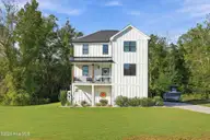 210 River Oats Court, Holly Ridge, NC 28445 — 4-bedroom waterfront home in Redd's Cove, Holly Ridge, NC, photo 5 of 69: 2_front center exterior