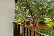 183 Drum Inlet, Morehead City, NC 28557 — 2-bedroom waterfront condo in Brandywine Bay, Morehead City, NC, photo 21 of 55: Balcony off of primary bedroom