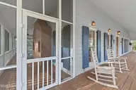 1321 Marsh Line Court SW, Shallotte, NC 28470 — 3-bedroom waterfront home in Marsh Cove, Shallotte, NC, photo 7 of 75: Left Side Front Porch