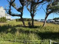 402 1 Fort Fisher Boulevard N, Kure Beach, NC 28449 — waterfront lot in Kure Dunes, Kure Beach, NC, photo 1 of 55: Front