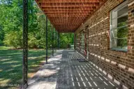 3109 Darrah Lane, Rocky Mount, NC 27804 — 3-bedroom waterfront home, Rocky Mount, NC, photo 13 of 54: Shaded under the balcony