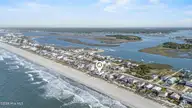 5127 W Beach Drive, Oak Island, NC 28465 — 5-bedroom waterfront home, Oak Island, NC, photo 2 of 73: 74_drone
