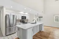 212 Kings Trail # A, Sunset Beach, NC 28468 — 3-bedroom townhome in Sea Trail Plantation, Sunset Beach, NC, photo 5 of 65: Upstairs kitchen