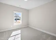 161 Twining Rose Lane, Holly Ridge, NC 28445 — 3-bedroom home in Summerhouse On Everett Bay, Holly Ridge, NC, photo 19 of 62: 2nd main floor bedroom