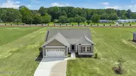 165 Huckleberry Bush Lane, Princeton, NC 27569 — 3-bedroom home in Graham's Place, Princeton, NC, photo 2 of 31: 002-496261-DJI_20260901121534_0366_D