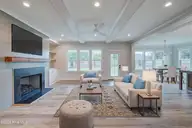 125 Cove Side Lane, Hampstead, NC 28443 — 4-bedroom waterfront home in Pelican Sound, Hampstead, NC, photo 6 of 29: Living Room Staged