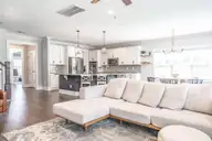 357 Wheatfield Way, Whispering Pines, NC 28327 — 5-bedroom home in Summerfield at Arrowstone, Whispering Pines, NC, photo 18 of 44: Living Room with Gas Fireplace