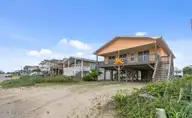210 W Beach Drive, Oak Island, NC 28465 — 4-bedroom waterfront home, Oak Island, NC, photo 2 of 42: Screenshot 2025-06-17 121552