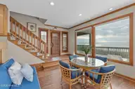 111 Dogwood Circle, Pine Knoll Shores, NC 28512 — 4-bedroom waterfront home in Pine Knoll Association, Pine Knoll Shores, NC, photo 22 of 52: Sitting area with patio access