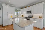 1711 E Fort Macon Road, Atlantic Beach, NC 28512 — 4-bedroom waterfront home in Asbury Beach, Atlantic Beach, NC, photo 9 of 42: kitchen Island