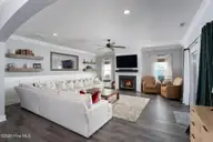 541 Moss Lake Lane, Holly Ridge, NC 28445 — 4-bedroom home in Summerhouse On Everett Bay, Holly Ridge, NC, photo 17 of 71: living-room-01a