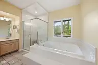 908 Sawgrass Court, New Bern, NC 28560 — 3-bedroom waterfront home in Fairfield Harbour, New Bern, NC, photo 21 of 51: Primary shower and tub