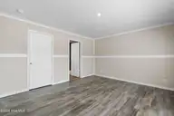 6812 Lewis Drive SE, Winnabow, NC 28479 — 3-bedroom manufactured home in Lewis Acres, Winnabow, NC, photo 17 of 27: Master