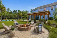13009 Bending River Way, Leland, NC 28451 — 4-bedroom waterfront home in Hawkeswater at the River, Leland, NC, photo 10 of 69: firepit