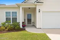 9414 Barnstormer Drive, Carolina Shores, NC 28467 — 3-bedroom waterfront home in Eagle Run, Carolina Shores, NC, photo 2 of 41: Front View
