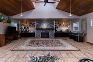 667 Yadkin Road, Southern Pines, NC 28387 — 5-bedroom home in Horse Country, Southern Pines, NC, photo 22 of 26: guesthouselivingroom1