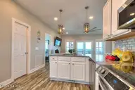 5103 W Beach Drive, Oak Island, NC 28465 — 4-bedroom waterfront home in W. Long Beach, Oak Island, NC, photo 17 of 65: 5103 W Beach Drive 16